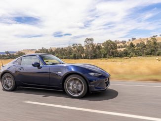 2023 Mazda MX-5 GT Convertible Black roof driving 1